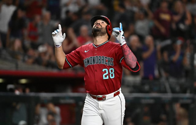 PHOENIX, ARIZONA - JULY 21: Eugenio Suarez #28 of the Arizona Diamondbacks reacts after hitting a solo home run against the Houston Astros during the third inning at Chase Field on July 21, 2025 in Phoenix, Arizona.