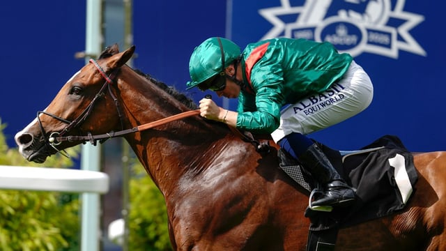 Barzalona crouches low as he drives Calandagan through the finishing line to win the King George VI and Queen Elizabeth Stakes at Ascot