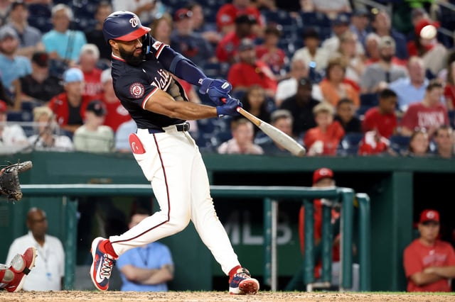 Jul 21, 2025; Washington, District of Columbia, USA; Washington Nationals third baseman Amed Rosario (13) hits an RBI double during the sixth inning against the Cincinnati Reds at Nationals Park. Mandatory Credit: Daniel Kucin Jr.-Imagn Images/File Photo
