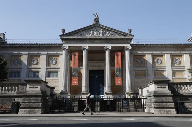 A man walks past the Ashmolean Museum in Oxford, southern central England, on April 24, 2020.