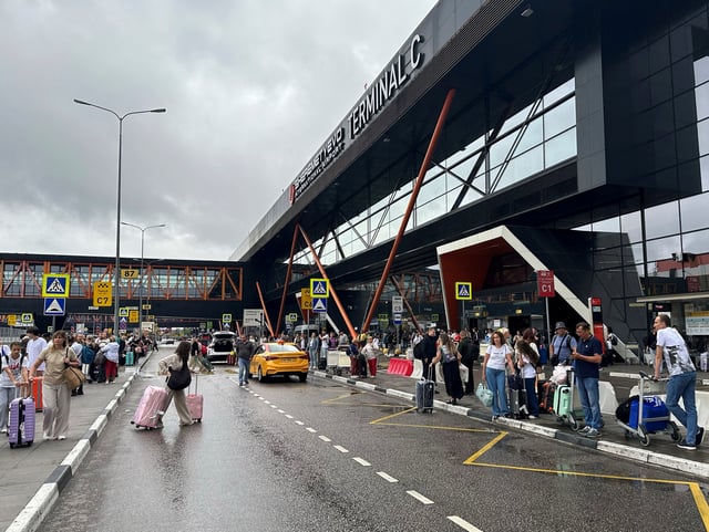 People wait outside Terminal C at the Sheremetyevo international airport outside Moscow, Russia July 21, 2025. REUTERS/Stringer/File Photo