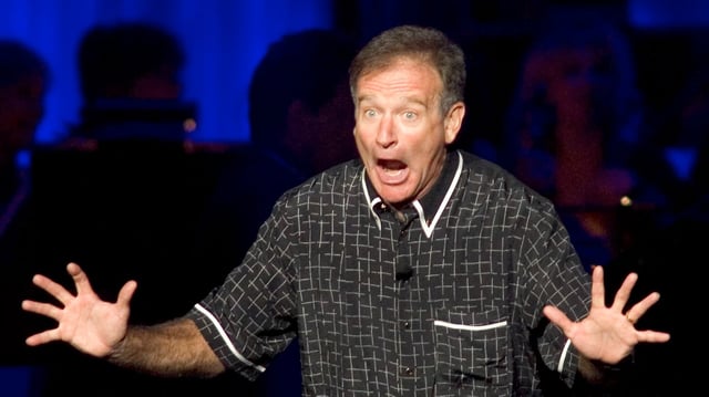 Comedian Robin Williams performs at the ninth annual Andre Agassi Charitable Foundation &#34;Grand Slam for Children&#34; benefit concert at the MGM Grand Garden Arena in Las Vegas, Nevada October 2, 2004. The event raises money to assist less fortunate children in Agassi&#39;s hometown of Las Vegas. REUTERS/Ethan Miller  EM/GB