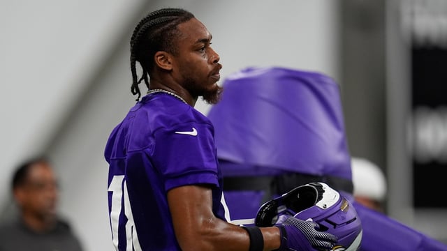 Minnesota Vikings wide receiver Justin Jefferson (18) stands on the field during the team's NFL football training camp Wednesday, July 23, 2025, in Eagan, Minn.