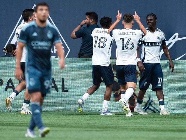 Vancouver Whitecaps' Emmanuel Sabbi (right) celebrates his goal against Sporting Kansas City with Vancouver's Edier Ocampo (18) and Sebastian Berhalter (16) during the first half of an MLS soccer match in Vancouver, on Saturday, July 26, 2025.