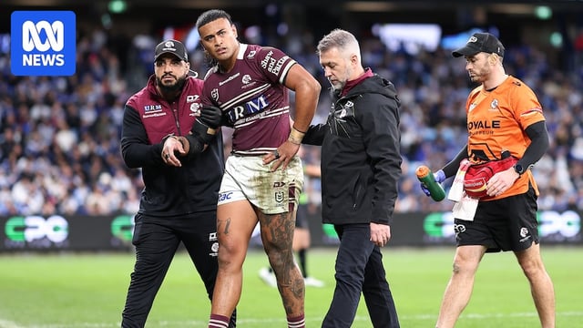 A man leaves the field due to an injury 