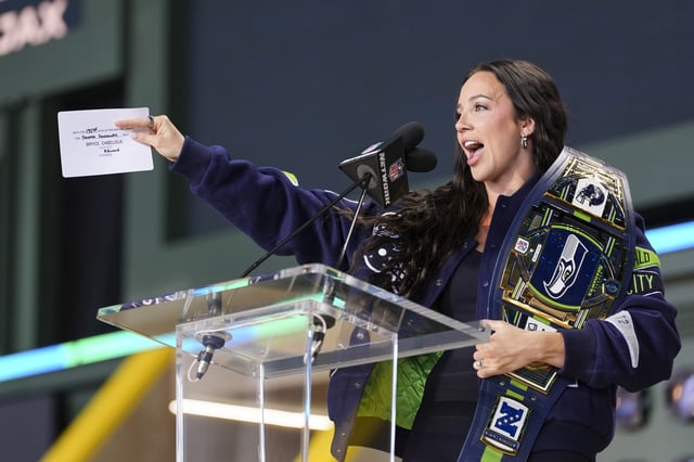 WWE&#39;s Chelsea Green announces a Seattle Seahawks pick during the during the third day of the 2025 NFL Draft on April 26, 2025 in Green Bay, Wisconsin.