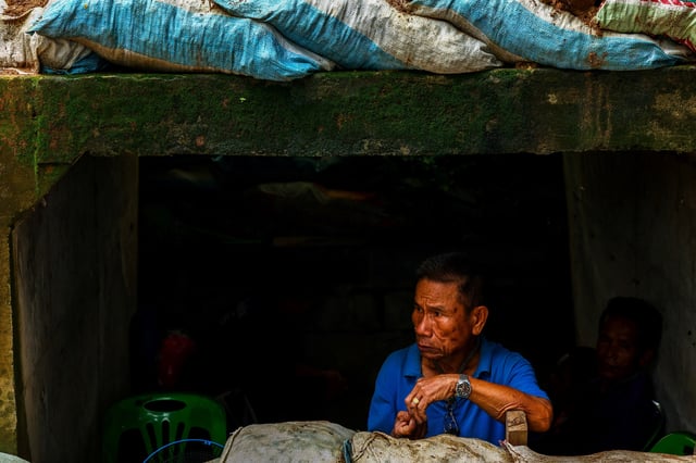 A man looks on inside a bunker in Sisaket province, as Cambodia and Thailand each said the other had launched artillery attacks across contested border areas early on Sunday, hours after U.S. President Donald Trump said the leaders of both countries had agreed to work on a ceasefire, Thailand, July 27, 2025. REUTERS/Athit Perawongmetha