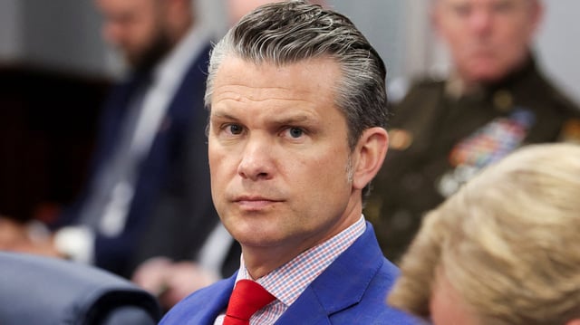 U.S. Defense Secretary Pete Hegseth waits for reporters to depart before continuing his meeting with Philippine President Ferdinand Marcos Jr. at the Pentagon, in Washington, D.C., U.S., July 21, 2025. REUTERS/Jonathan Ernst   REFILE - QUALITY REPEAT