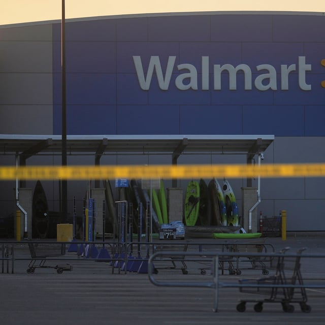 Police tape is seen outside a Walmart where multiple people were stabbed in a violent attack Saturday, July 26, 2025, in Traverse City, Mich (AP Photo/Ryan Sun)