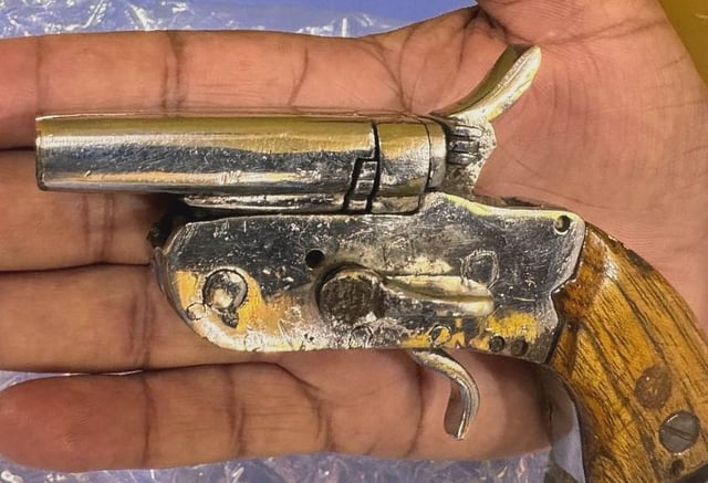 A double barrel country made pistol recovered from his Yaseen&#39;s aide