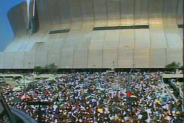 A crowd of stranded New Orleans residents are gathered outside of the Superdome following Hurricane Katrina in 2005.