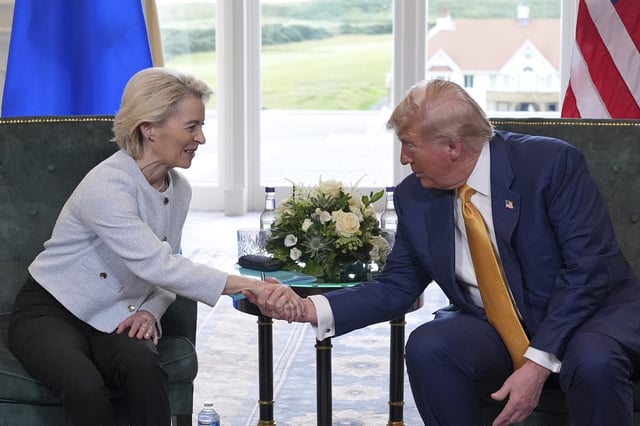 President Donald Trump shakes hands with European Commission President Ursula von der Leyen as they meet at the Trump Turnberry golf course in Turnberry, Scotland Sunday, July 27, 2025. (AP Photo/Jacquelyn Martin)