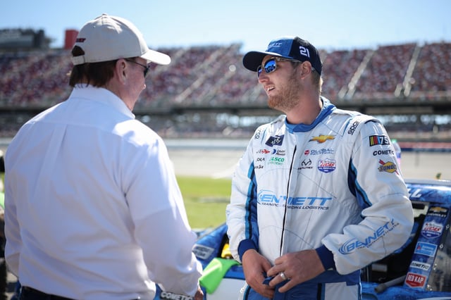 Austin Hill, driver of the #21 Bennett/Realtree Chevrolet, speaks with RCR team owner and NASCAR Hall of Famer, Richard Childress on the grid prior to the NASCAR Xfinity Series Ag-Pro 300 at Talladega Superspeedway on April 22, 2023 in Talladega, Alabama.