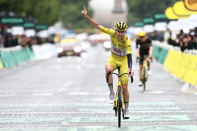 UAE Team Emirates - XRG team's Slovenian rider Tadej Pogacar celebrates his overall victory as he cycles to the finish line of the 21st and final stage of the 112th edition of the Tour de France cycling race, 132.3 km between Mantes-la-Ville and Paris Champs-Élysees, on July 27, 2025.