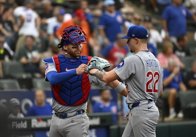 CHICAGO, ILLINOIS - JULY 26: Pitcher Cade Horton #22 and catcher Carson Kelly #15 of the Chicago Cubs fist bump at the conclusion of the third inning of the game against the Chicago White Sox at Rate Field on July 26, 2025 in Chicago, Illinois.