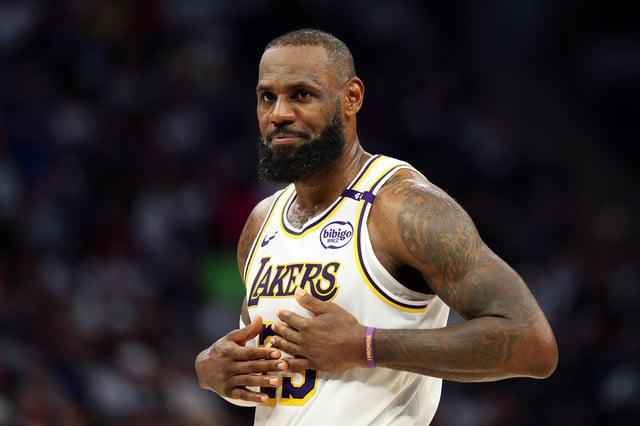 LeBron James #23 of the Los Angeles Lakers looks on against the Minnesota Timberwolves in the third quarter of Game Four of the First Round of the 2025 NBA Playoffs at Target Center on April 27, 2025 in Minneapolis, Minnesota.