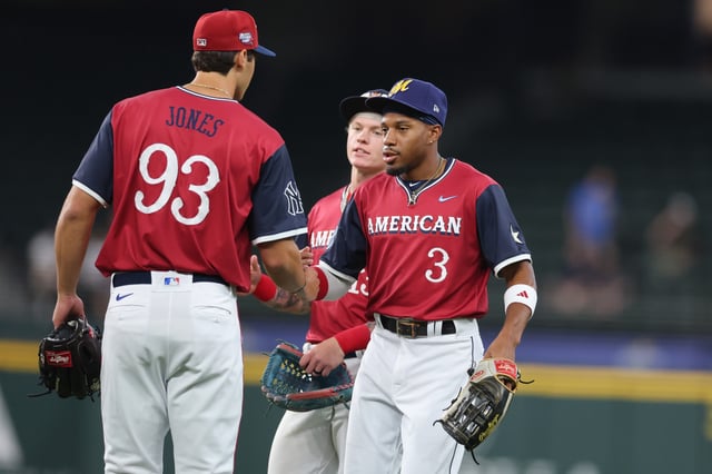 ARLINGTON, TEXAS - JULY 13: Chandler Simpson #3 of the Tampa Bay Rays shakes hands with Spencer Jones #93 of the New York Yankees prior to the All-Star Futures Game at Globe Life Field on July 13, 2024 in Arlington, Texas.
