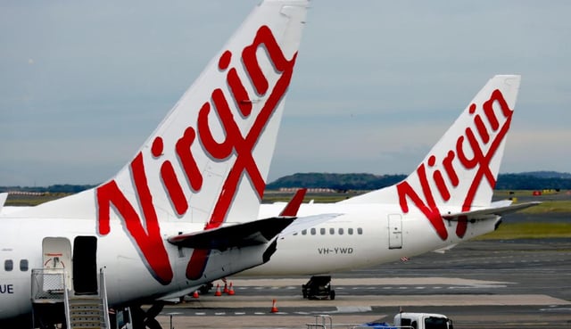 A Virgin Australia aircraft was damaged after a tug collided with the side of the plane. NewsWire / Nicholas Eagar