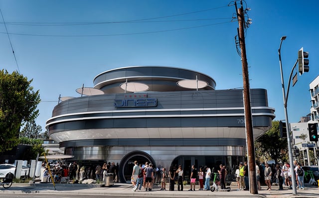 A diners line up and wait to enter the Tesla Diner, an American diner and a Tesla Supercharging station in the Hollywood section of Los Angeles on Tuesday, July 22, 2025.