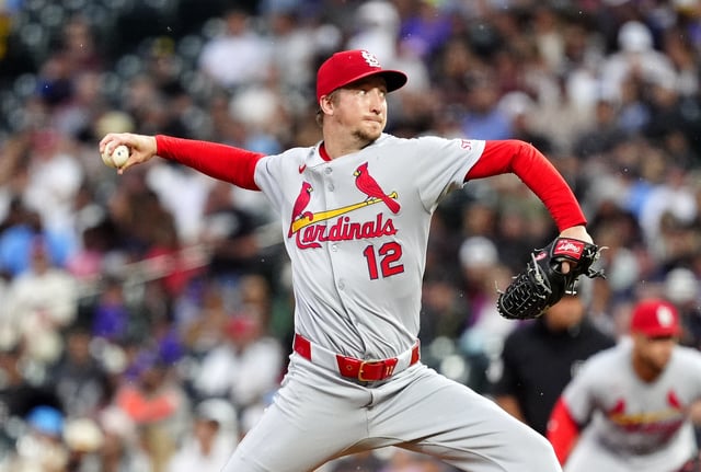 Jul 22, 2025; Denver, Colorado, USA; St. Louis Cardinals starting pitcher Erick Fedde (12) delivers a pitch in the third inning against the Colorado Rockies at Coors Field. Mandatory Credit: Ron Chenoy-Imagn Images/File Photo