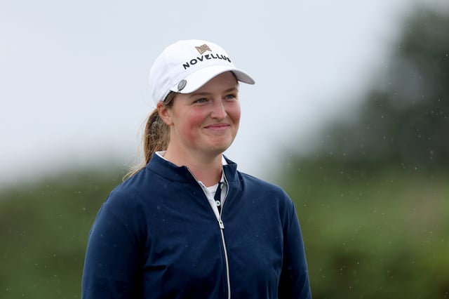 Lottie Woad of England smiles during the presentation ceremony as she celebrates victory of the ISPS HANDA Women&#39;s Scottish Open following the final round of the ISPS HANDA Women&#39;s Scottish Open 2025 at Dundonald Links Golf Course on July 27, 2025 in Troon, Scotland.