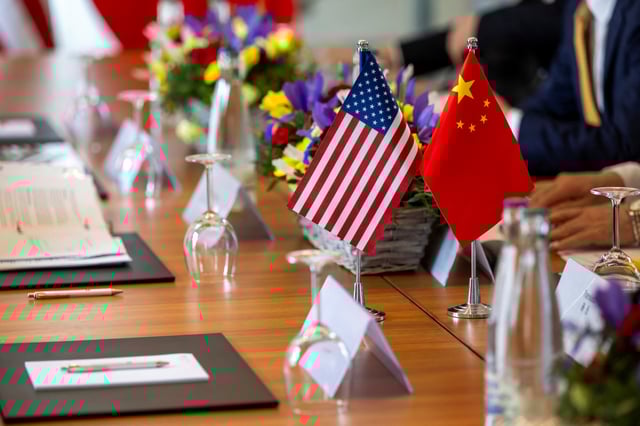 The American and Chinese flags are photographed on the negotiating table, during a bilateral meeting between the United States and China, in Geneva, Switzerland, May 10, 2025. KEYSTONE/EDA/Martial Trezzini/Handout via REUTERS/ File Photo