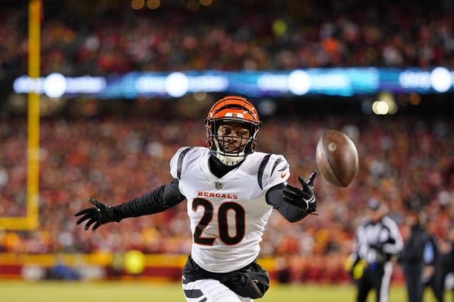 Jan 29, 2023; Kansas City, Missouri, USA; Cincinnati Bengals cornerback Eli Apple (20) reaches for the ball against the Kansas City Chiefs during the first quarter of the AFC Championship game at GEHA Field at Arrowhead Stadium. Mandatory Credit: Jay Biggerstaff-USA TODAY Sports/File Photo