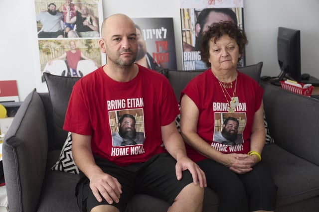 Freed Israeli hostage Iair Horn and his mother, Ruty Chmiel Strum, pose for a photograph in Kfar Saba, Israel, on Sunday, July 27, 2025. (AP Photo/Ariel Schalit)