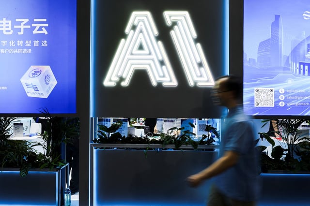 A person visits the World Artificial Intelligence Conference in Shanghai, China July 26, 2025.  REUTERS/Go Nakamura/ File Photo