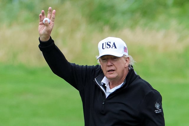 U.S. President Donald Trump holds a golf ball at Trump Turnberry resort in Turnberry, Scotland, Britain, July 27, 2025. REUTERS/Phil Noble
