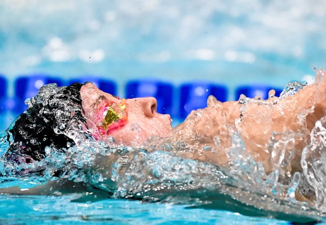 Jun 6, 2025; Indianapolis, Indiana, UNITED STATES; Regan Smith swims in the women’s 100 meter backstroke at the Toyota National Championships swimming meet at Indiana University Natatorium. Mandatory Credit: Robert Goddin-Imagn Images