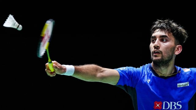India's Lakshya Sen hits a return against Japan's Kodai Naraoka during their men's singles match of the Japan Open badminton tournament at Tokyo Gymnasium in Tokyo on July 17, 2025. (Photo by Yuichi YAMAZAKI / AFP)