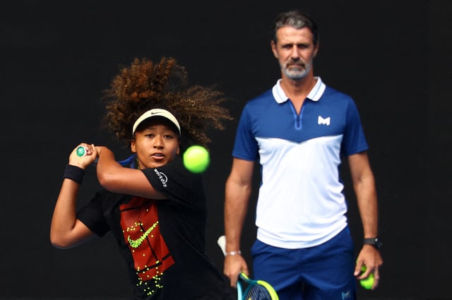 Tennis - Australian Open - Practice - Melbourne Park, Melbourne, Australia - January 9, 2025 Japan's Naomi Osaka during a practice session as coach Patrick Mouratoglou looks on ahead of the Australian Open REUTERS/Edgar Su/File Photo