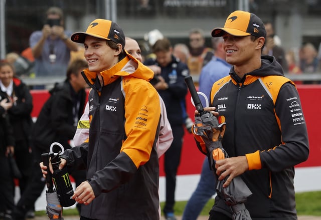 Formula One F1 - Belgian Grand Prix - Circuit de Spa-Francorchamps, Stavelot, Belgium - July 27, 2025 McLaren's Oscar Piastri and McLaren's Lando Norris before the race REUTERS/Stephanie Lecocq