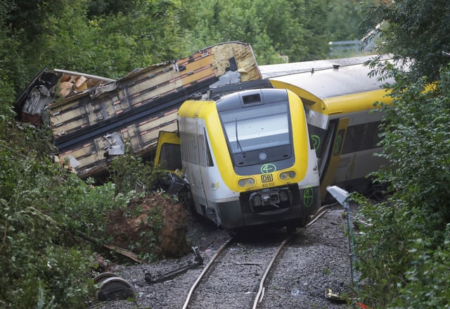 Wagons of a derailed regional passenger train lie on a railroad line near Riedlingen, Germany, Monday, July 28, 2025. 