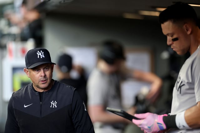SEATTLE, WASHINGTON - MAY 14: Manager Aaron Boone #17 and Aaron Judge #99 of the New York Yankees look on during the third inning Mariners at T-Mobile Park on May 14, 2025 in Seattle, Washington.