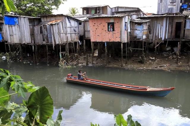 FILE - A boat goes down a tributary of the Tucunduba River in Belem, Brazil, Sept. 23, 2024. (AP Photo/Paulo Santos, File)