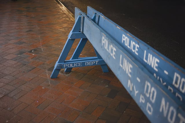 NYPD barriers stand on a street in Manhattan in 2025.