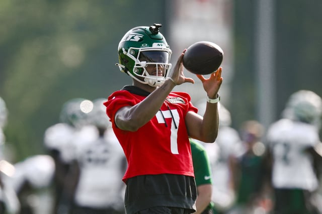 Jul 25, 2025; Florham Park, NJ, USA; New York Jets quarterback Justin Fields (7) catches a ball during a drill at training camp at Atlantic Health Jets Training Center. Mandatory Credit: John Jones-Imagn Images
