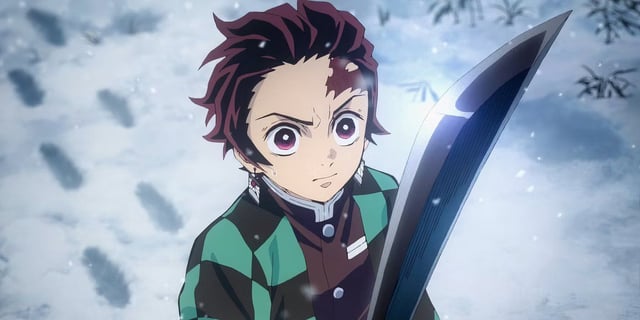 Tanjiro holding a black nichirin blade in the snow in Demon Slayer.