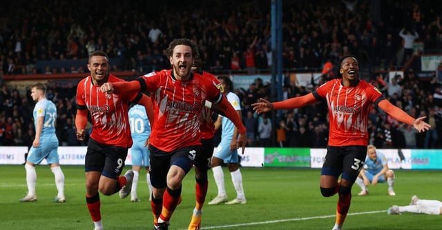 Soccer Football - Championship - Play-off - Semi Final - Second Leg - Luton Town v Sunderland - Kenilworth Road, Luton, Britain - May 16, 2023 Luton Town's Tom Lockyer celebrates scoring their second goal with teammates Action Images via Reuters/Lee Smith