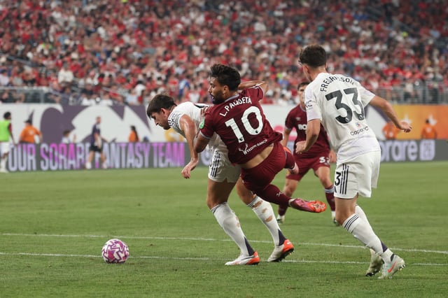 EAST RUTHERFORD, NEW JERSEY – JULY 26: Lucas Paqueta of West Ham United collides with Harry Maguire of Manchester United during the Premier League Summer Series match between Manchester United and West Ham United FC at MetLife Stadium on July 26, 2025 in East Rutherford, New Jersey. (Photo by Vincent Carchietta/Getty Images)