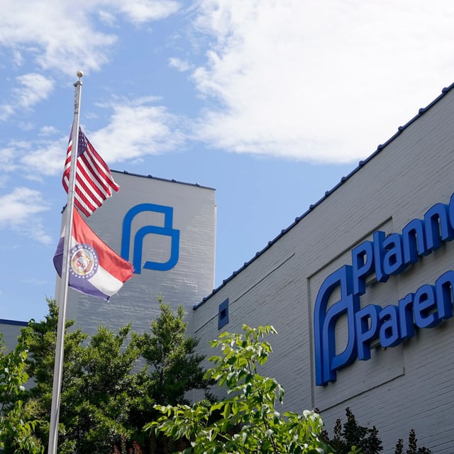 FILE - A Missouri and American flag fly outside Planned Parenthood in St. Louis, June 24, 2022. (AP Photo/Jeff Roberson, File)
