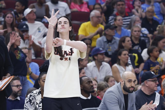Jul 27, 2025; Chicago, Illinois, USA; Injured Indiana Fever guard Caitlin Clark (22) reacts during the first half of a basketball game against the Chicago Sky at United Center. Mandatory Credit: Kamil Krzaczynski-Imagn Images/File Photo