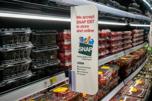 A food stamps sign inside a supermarket. (Shutterstock)
