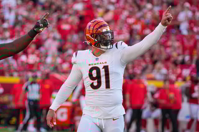 Sep 15, 2024; Kansas City, Missouri, USA; Cincinnati Bengals defensive end Trey Hendrickson (91) celebrates against the Kansas City Chiefs after a play during the game at GEHA Field at Arrowhead Stadium. Mandatory Credit: Denny Medley-Imagn Images/File Photo