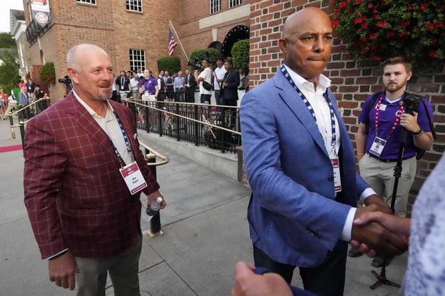 Hall of Fame closers Billy Wagner, left, and Mariano Rivera greet fans after the Hall of Fame Legends Parade in Cooperstown, N.Y., Saturday, July 26, 2025.