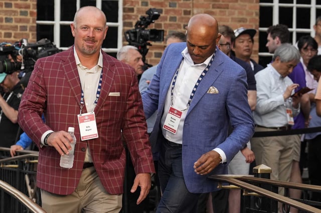 Former Houston Astros closer and Hall of Fame pitcher Billy Wagner, left, walks with Hall of Famer Mariano Rivera at the end of the Hall of Fame Legends Parade in Cooperstown, N.Y., Saturday, July 26, 2025.