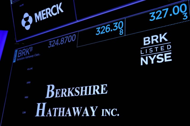 Trading information and logo for Berkshire Hathaway is displayed on a screen on the floor of the New York Stock Exchange (NYSE) in New York City, U.S., May 10, 2023.  REUTERS/Brendan McDermid/File Photo
