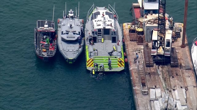 Search and rescue crews responded to the collision of a barge with a sailboat in Biscayne Bay near Hibiscus Island, Florida, on Monday.